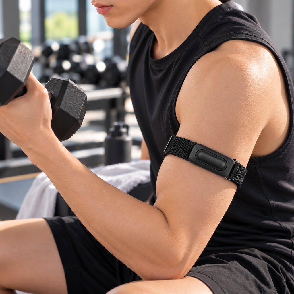 Black Fitbit Air nylon armband shown during dumbbell training; device not included